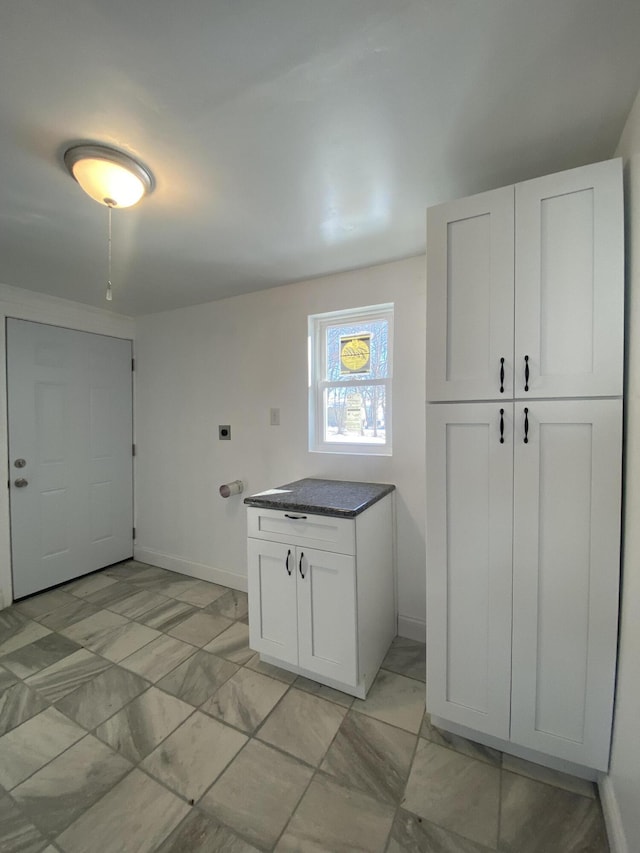 kitchen featuring white cabinetry