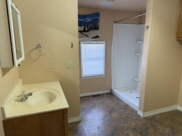 bathroom featuring vanity and walk in shower