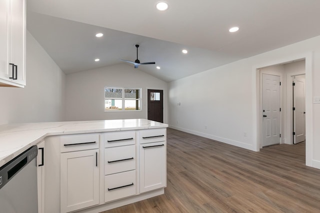 kitchen featuring stainless steel dishwasher, light wood-style floors, white cabinets, light stone countertops, and a peninsula