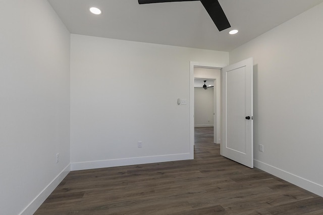 unfurnished room featuring ceiling fan and dark hardwood / wood-style floors