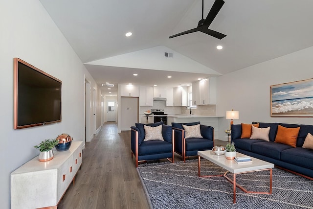 living area with high vaulted ceiling, recessed lighting, wood finished floors, visible vents, and a ceiling fan