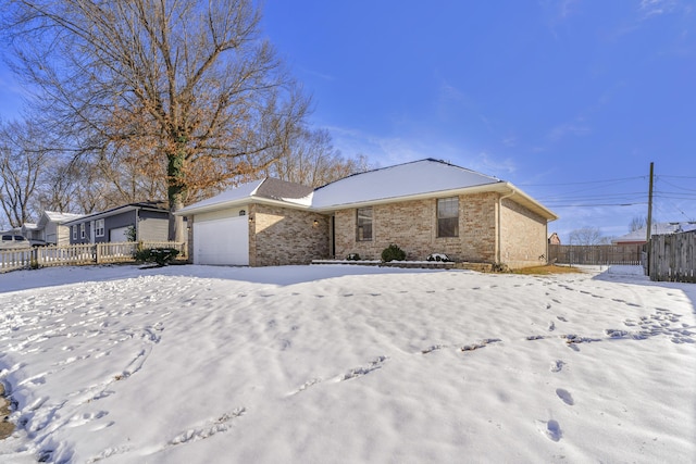 single story home featuring a garage