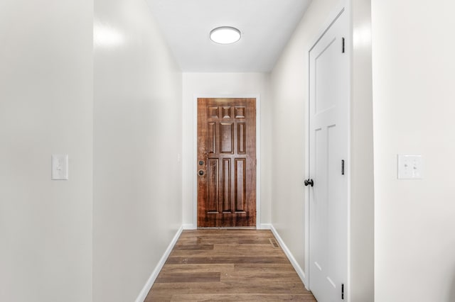 corridor featuring hardwood / wood-style floors