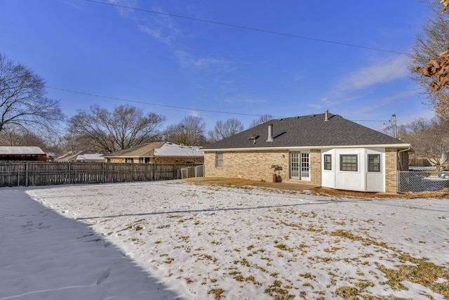 view of snow covered property