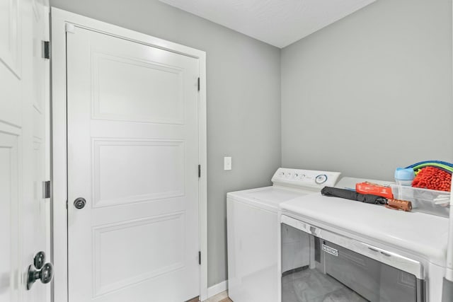 laundry area with sink and washing machine and dryer