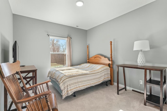 bedroom with light carpet