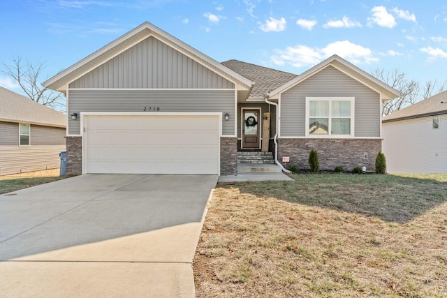 craftsman inspired home with a garage and a front yard