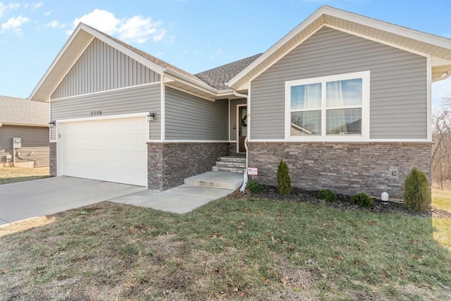 view of front of house with a garage and a front yard