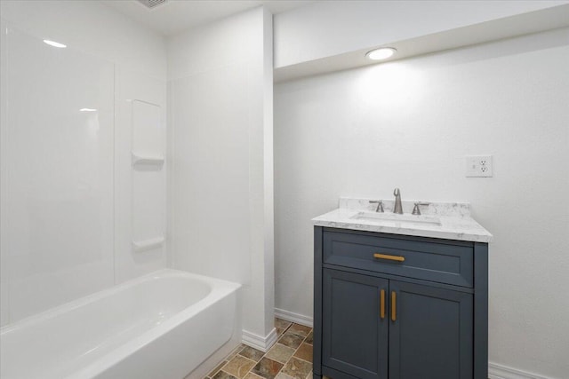 bathroom featuring vanity and tub / shower combination