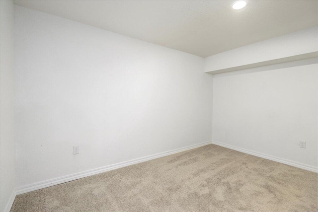 unfurnished room featuring carpet flooring