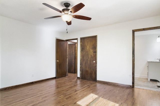 unfurnished bedroom featuring ceiling fan and wood-type flooring