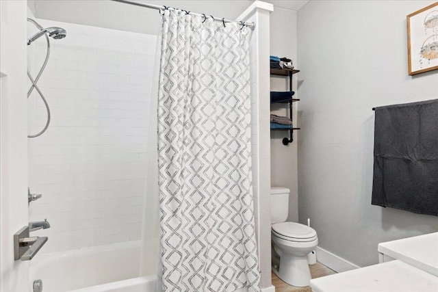 bathroom with toilet and shower / tub combo with curtain