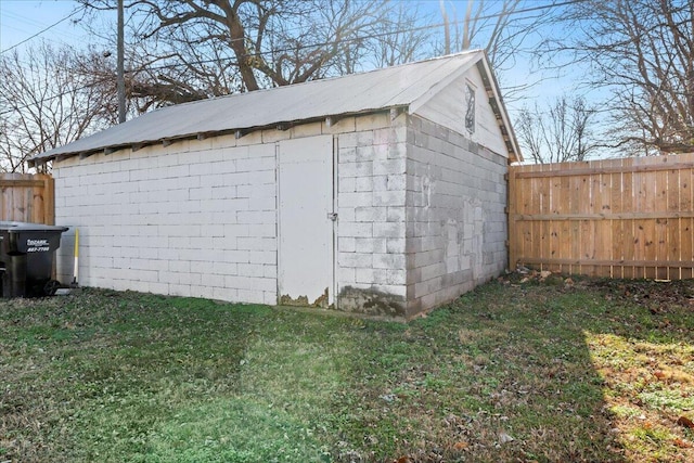 view of outdoor structure featuring a lawn