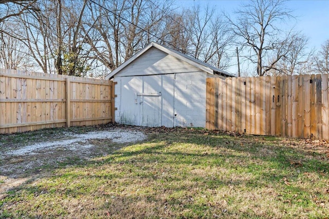 view of outdoor structure featuring a lawn