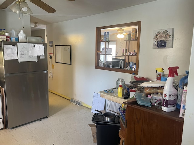 kitchen featuring black refrigerator