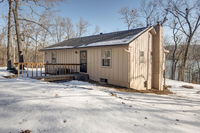 view of front of property with a wooden deck