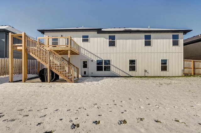 back of house featuring a deck