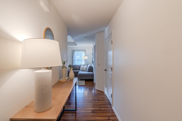 hallway with dark wood-type flooring