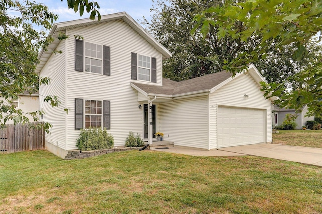 view of front of house featuring a front yard and a garage