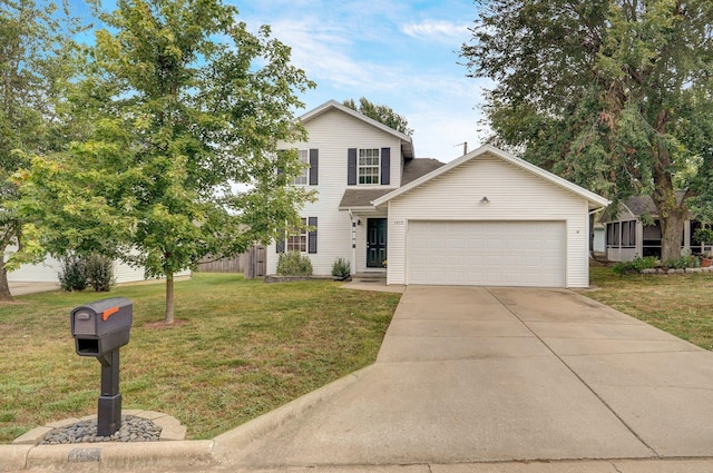 view of front of property with a front yard and a garage