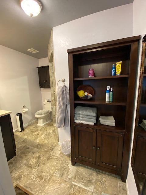 bathroom with vanity and toilet