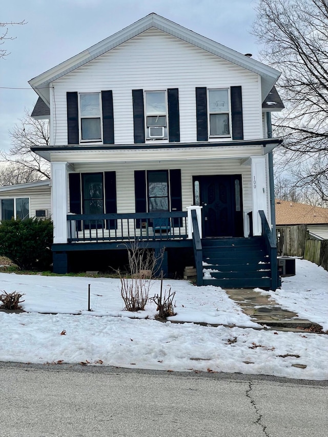 view of property featuring covered porch