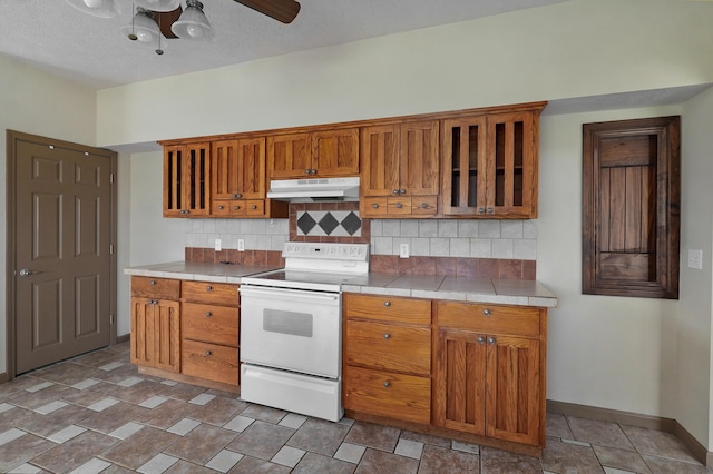 kitchen with white electric range oven, a textured ceiling, tasteful backsplash, and ceiling fan