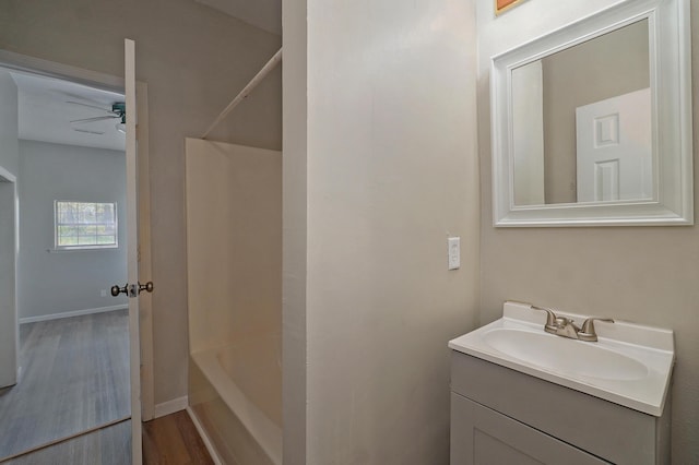 bathroom with vanity, ceiling fan, and wood-type flooring