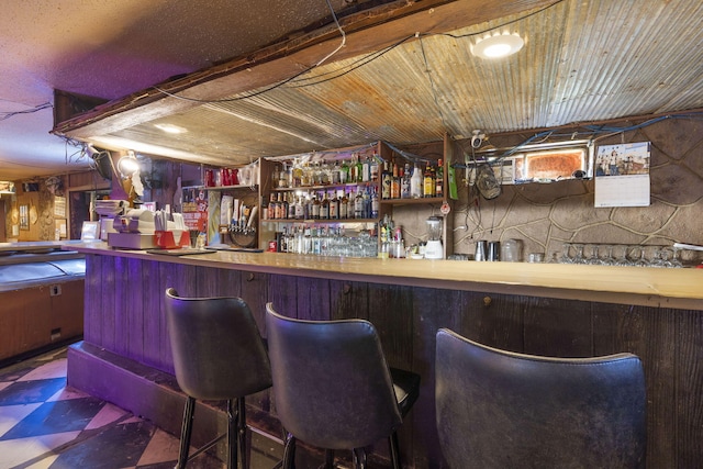 bar featuring wooden ceiling