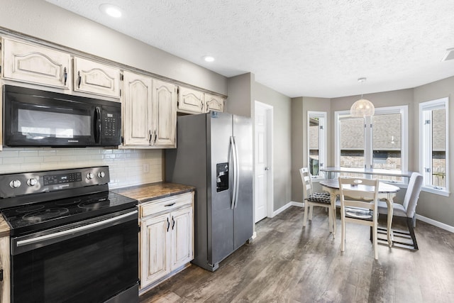 kitchen with stainless steel refrigerator with ice dispenser, backsplash, decorative light fixtures, electric range oven, and a textured ceiling