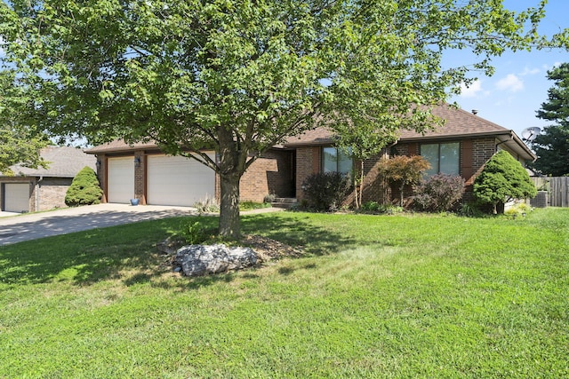 view of front of home featuring a garage and a front lawn