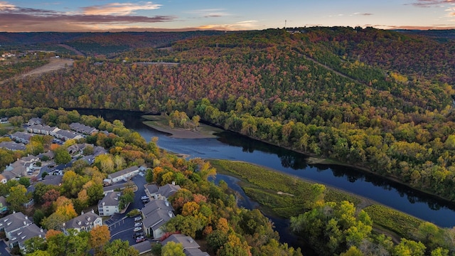 aerial view at dusk with a water view