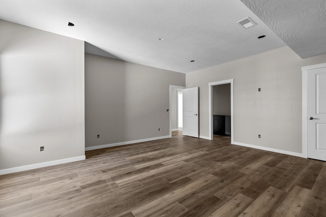 unfurnished room featuring wood-type flooring