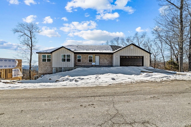 view of front of property with a garage