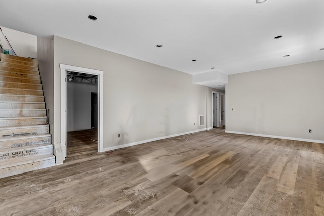 spare room with wood-type flooring