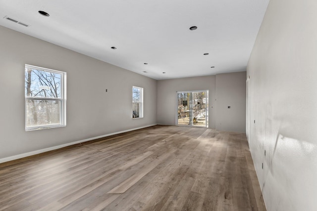 unfurnished room featuring light hardwood / wood-style floors