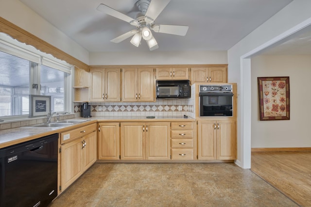 kitchen with sink, light brown cabinets, ceiling fan, backsplash, and black appliances