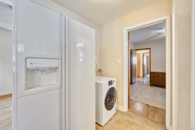 laundry room featuring washer / dryer and light hardwood / wood-style floors