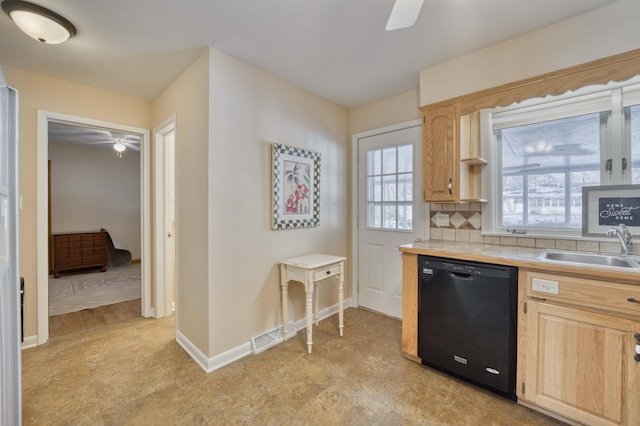 kitchen featuring ceiling fan, light brown cabinetry, decorative backsplash, sink, and black dishwasher