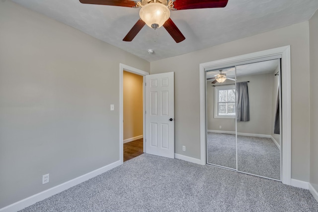 unfurnished bedroom with a closet, ceiling fan, and carpet