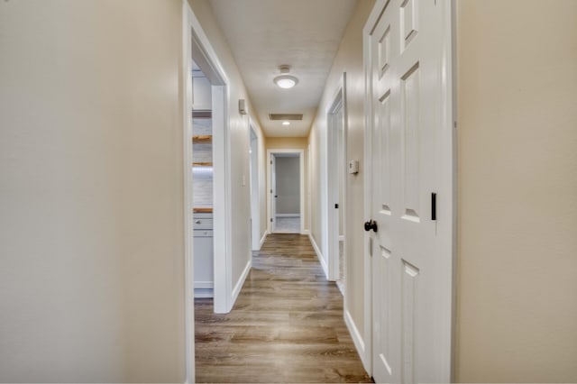 hall with light wood-type flooring