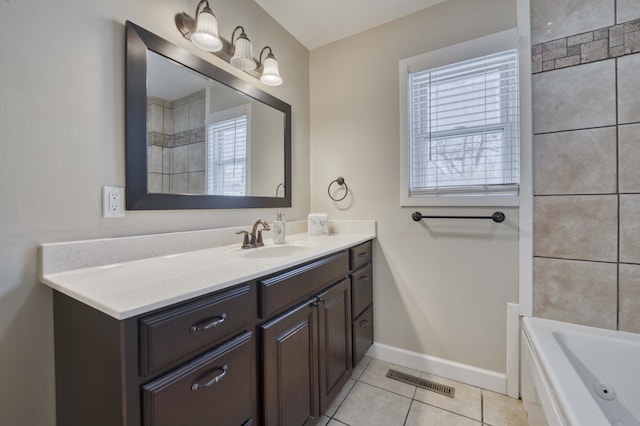 bathroom featuring vanity, tile patterned floors, and a bathing tub