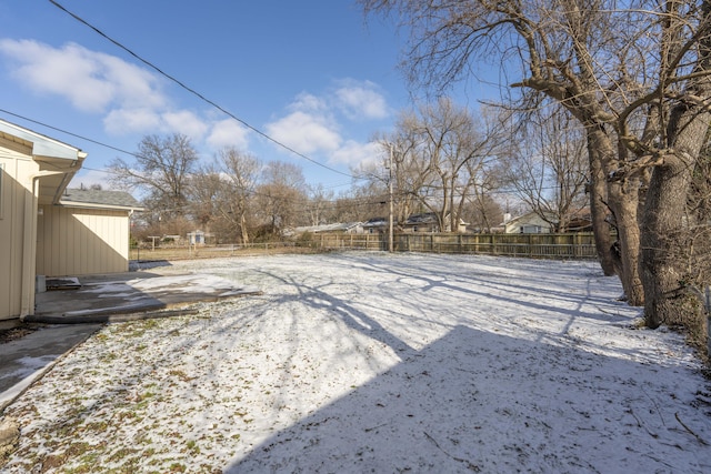 view of yard layered in snow