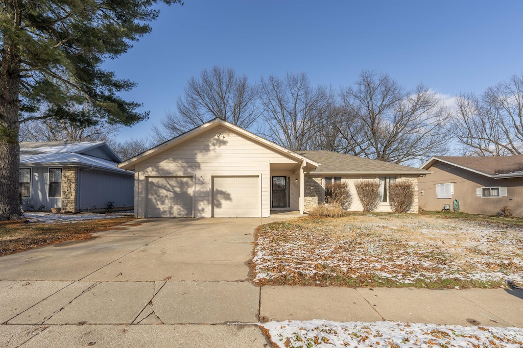 ranch-style house featuring a garage