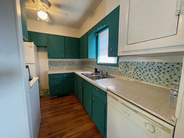 kitchen featuring white dishwasher, dark hardwood / wood-style flooring, backsplash, and sink