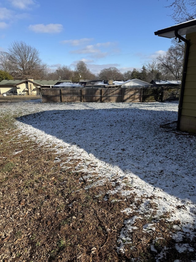 view of yard layered in snow