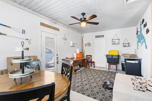 dining space featuring ceiling fan, wood ceiling, and ornamental molding