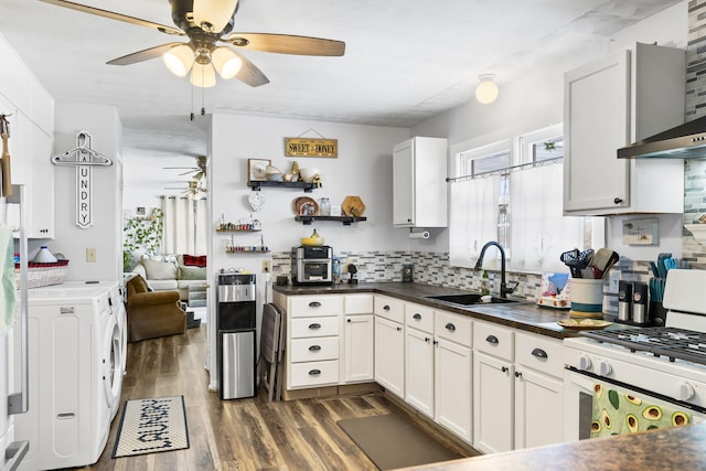 kitchen with sink, white cabinetry, gas range gas stove, and plenty of natural light