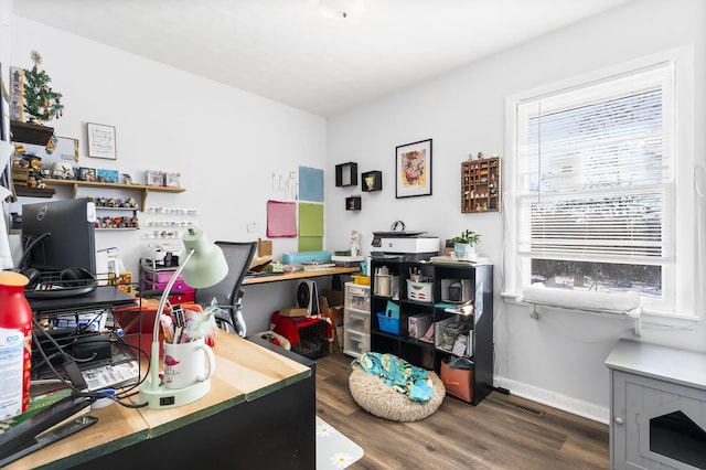 office area with dark wood-type flooring and plenty of natural light