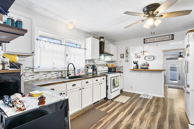 kitchen featuring white appliances, sink, backsplash, and white cabinetry